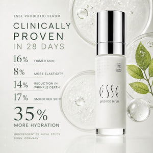 Essé Probiotic Serum bottle on a clean white background with marketing text on the left and decorative glass droplets and green leaves on the right.