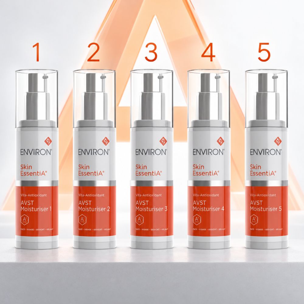 Five ENVIRON Skincare Skin EssentiA AVST moisturiser pump bottles arranged in a row on a white surface, each labeled with a level from 1 to 5 above it. The bottles are silver and white with orange-red label bands and clear caps. Authorised Shop UK.