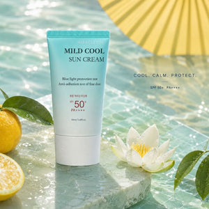 Miracletox Mild Cool Sun Cream SPF 50+ in a light blue and white tube, styled on a stone slab with water droplets, a white lotus flower, a lemon, and a yellow parasol against a tropical water background.