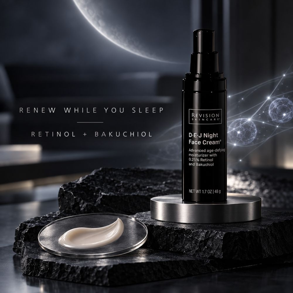 Revision Skincare D-E-J Night Face Cream bottle displayed on a metallic stand with a dollop of cream in a small dish, set on dark stone against a moody dark background with a moon and glowing orb graphics.