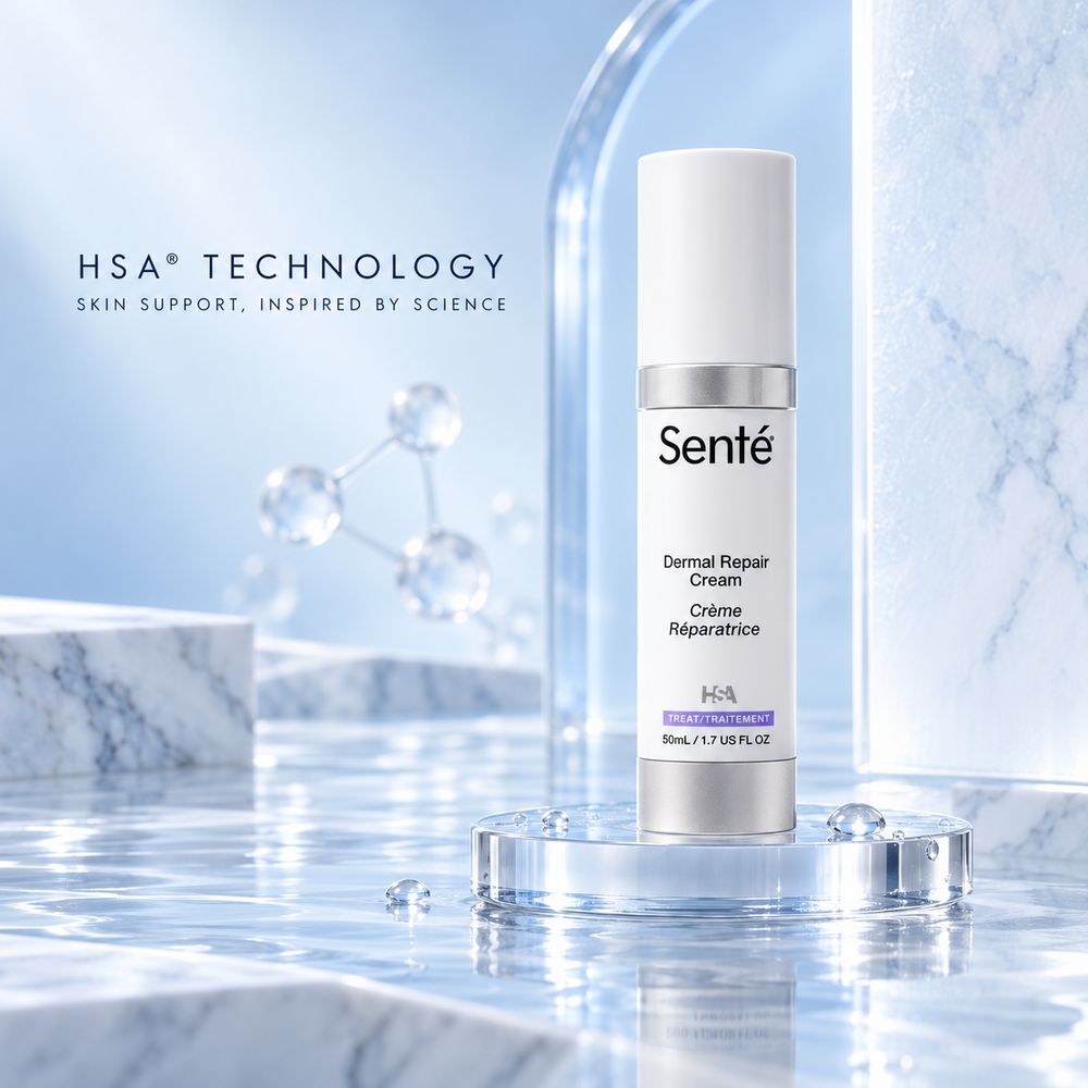Sente Dermal Repair Cream in a white cylindrical bottle with a silver cap, displayed on a clear acrylic pedestal in a clean, icy blue studio setting with water and marble textures.