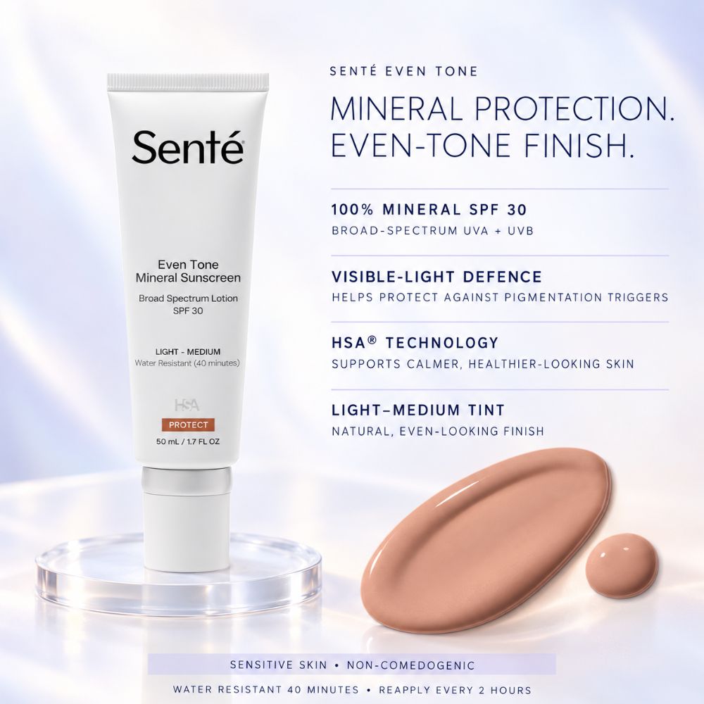 Senté Even Tone Mineral Protection SPF 30 sunscreen tube displayed on a clear acrylic stand, with product details and a beige-tan liquid swatch on a white background.
