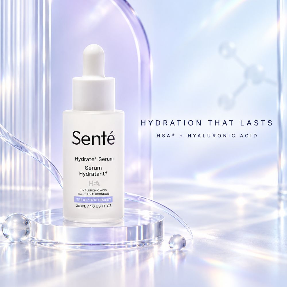 Sente Hydrate+Serum in a white dropper bottle, displayed on a clear acrylic pedestal with a soft, glowing blue and purple background and text reading 'HYDRATION THAT LASTS'.